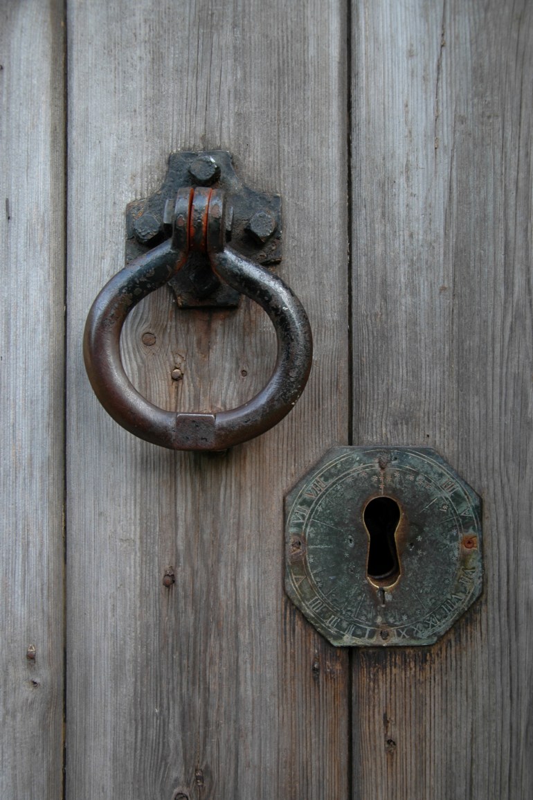 Church of England parish church of St Mary, Sydenham, Oxfordshire: detail of south door, with a keyway made from a brass sundial, by Uploaded by Motacilla, CC BY-SA 3.0
