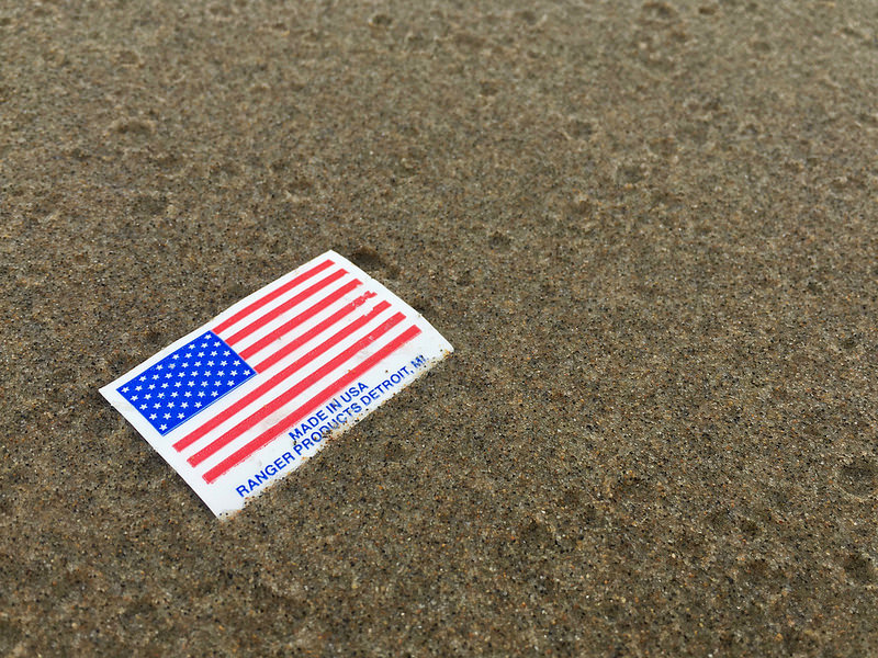 American flag sticker on the sand