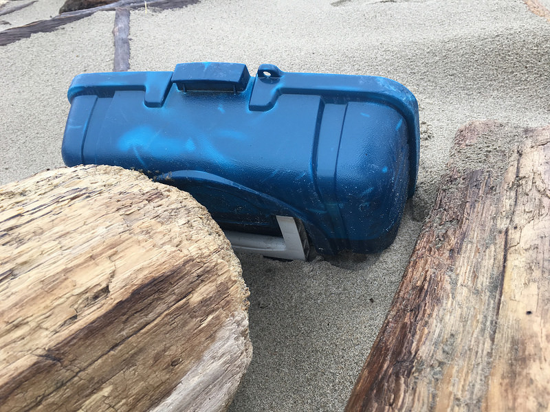 blue plastic tool box or tackle box lid up in the wrack