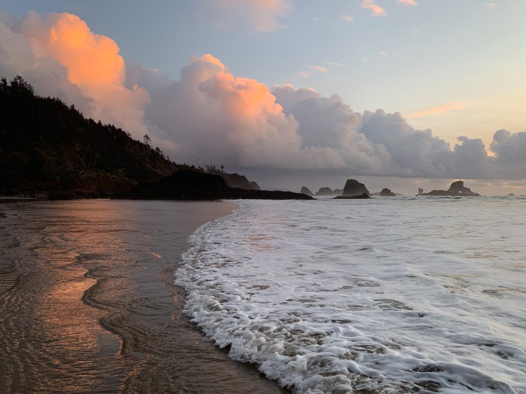 Sunset on clouds, from the swash zone