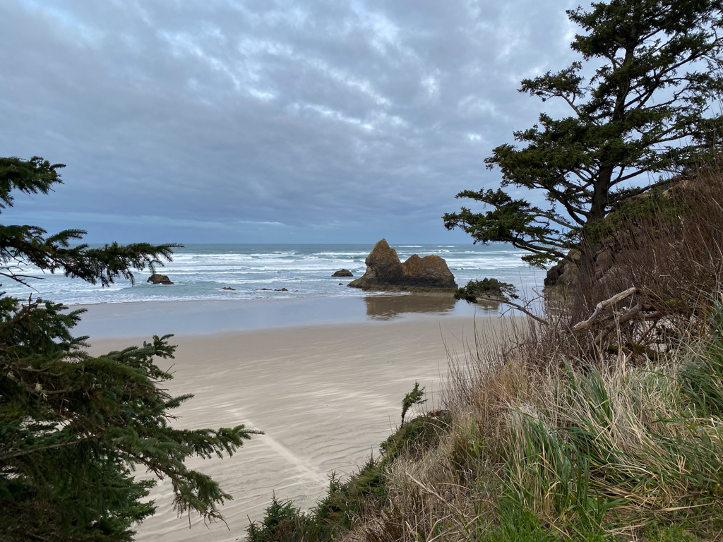 View of The Lion, and iconic outcrop, from high above the beach